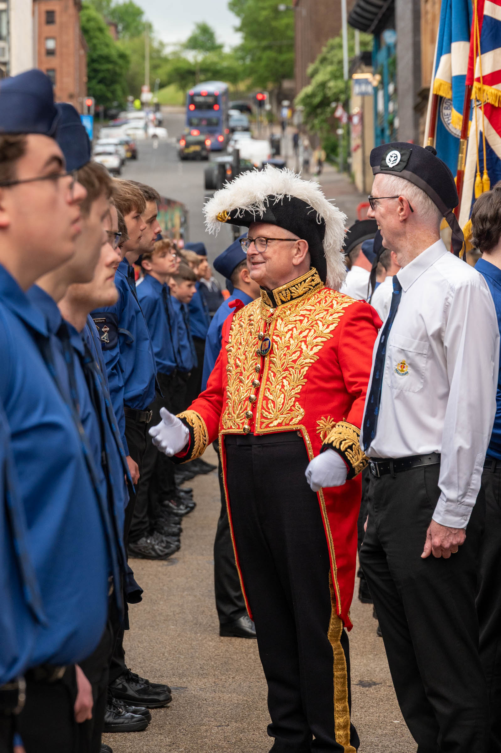 The Lord Lyon talks to the King's Badge and President's Badge Recipients as he inspects them outside Glasgow City Chambers